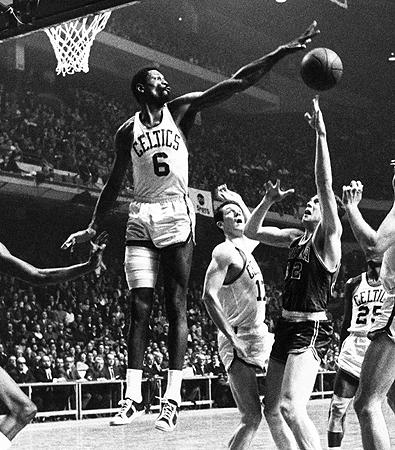 Bill Russell blocking the basketball shot of another player