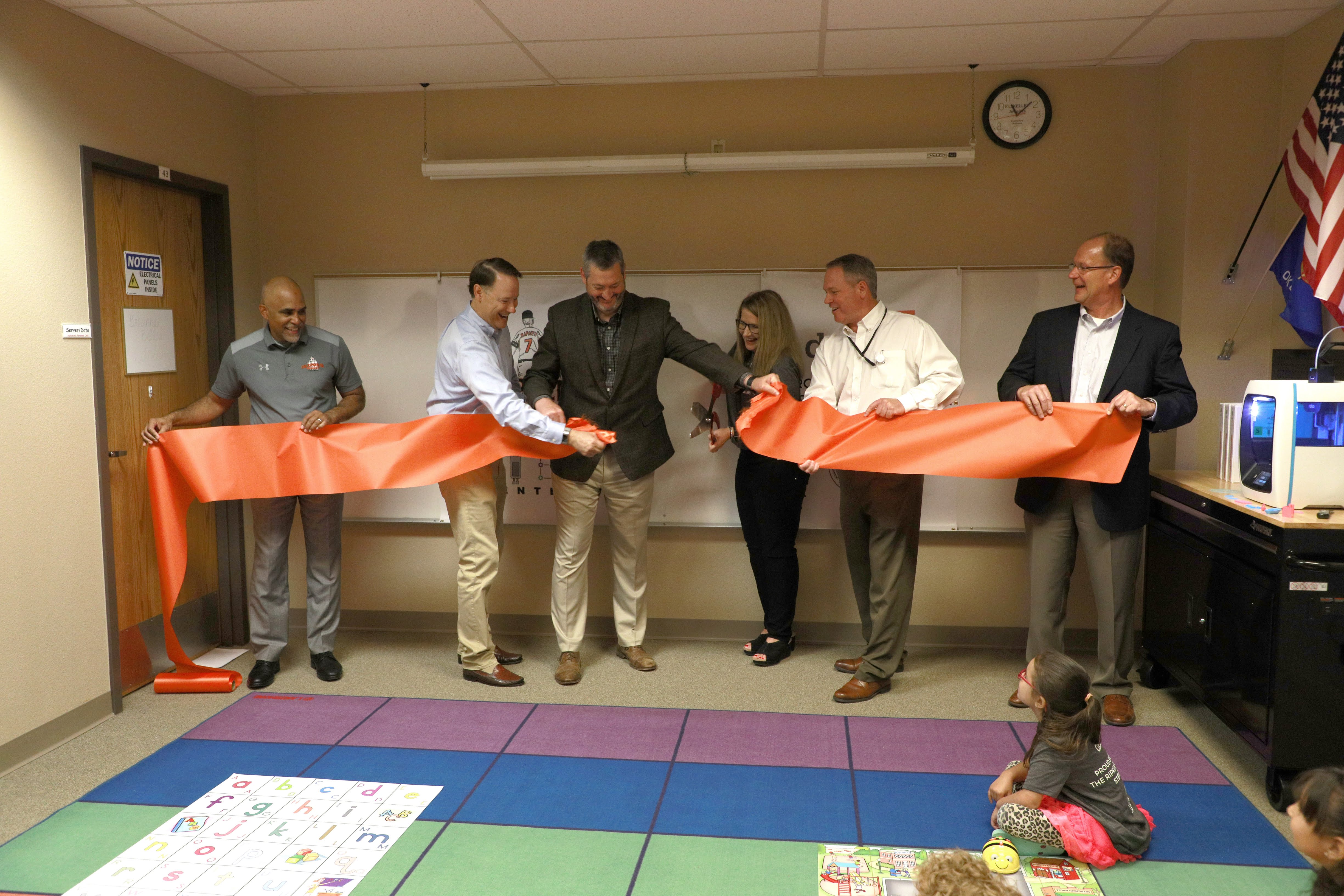 Cutting the ribbon to officially open the STEM Center