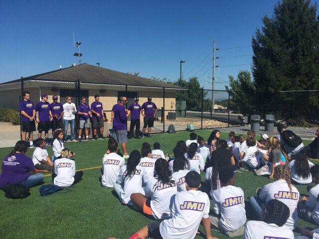 Youth at James Madison University College Day Experience listening to student athletes