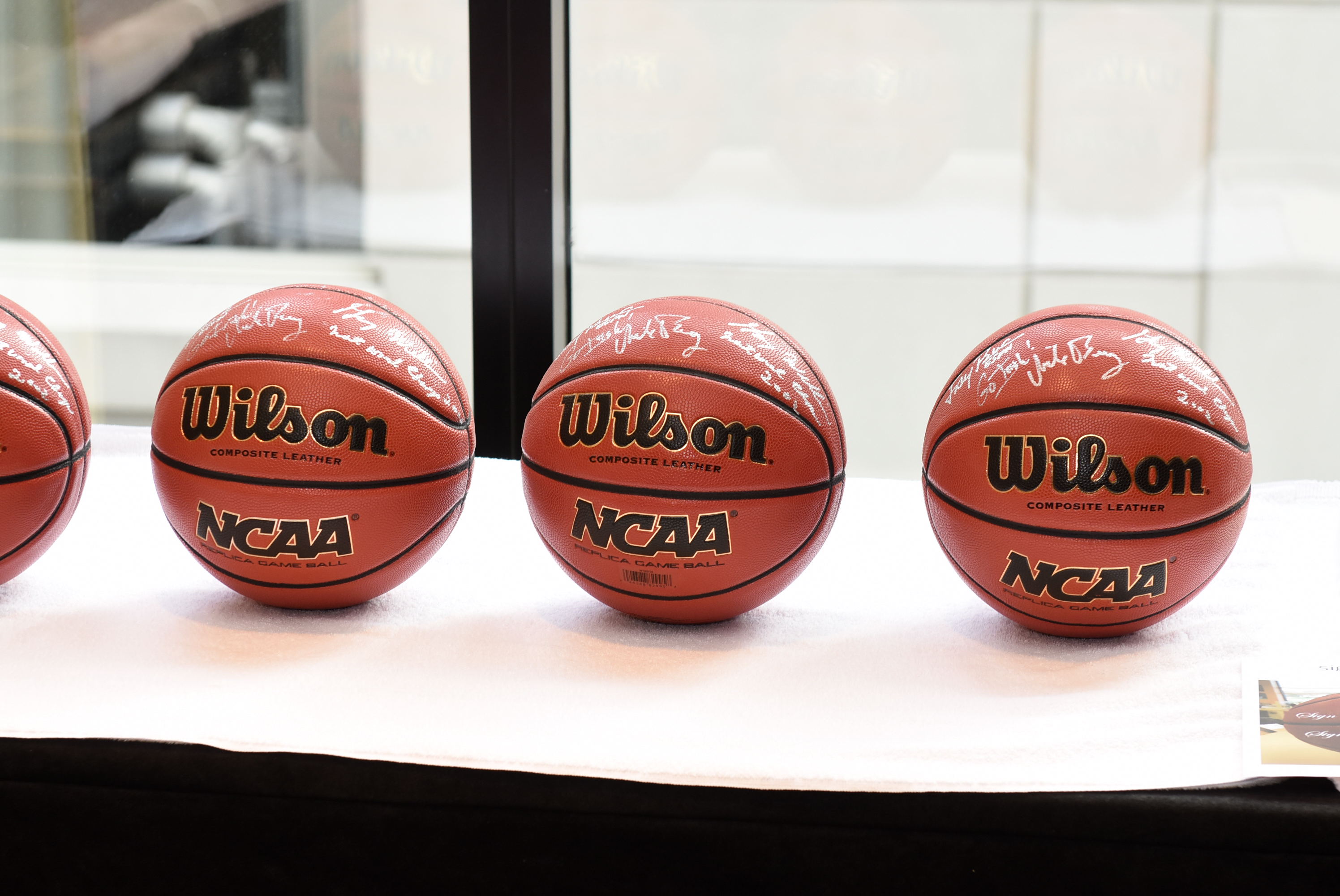 basketballs signed by event basketball coaches