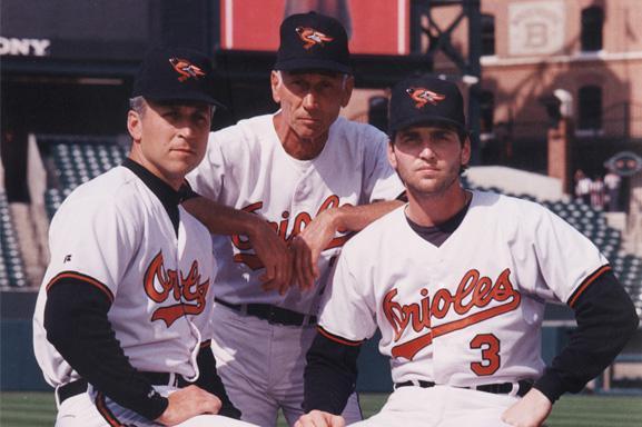 Cal, Jr., Cal, Sr., and Bill Ripken in Orioles uniforms