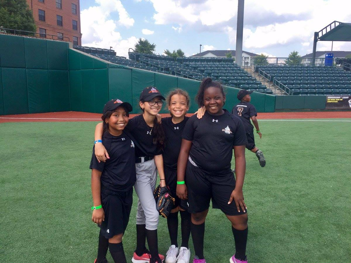 Four girls smiling at camp