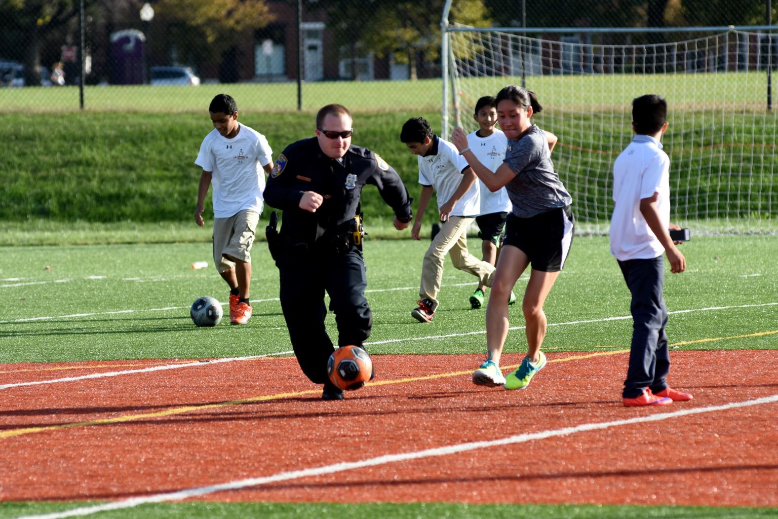 police office and girl playing soccer