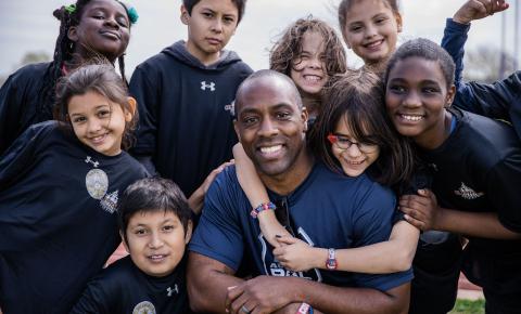 Austin Police Department Officer Jeremy Bohannon with youth at a clinic