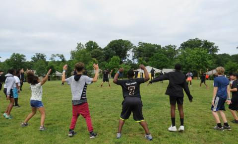 Campers doing jumping jacks