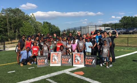 A group of youth and volunteers getting ready to play quickball