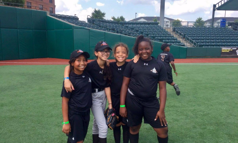 Four girls smiling at camp